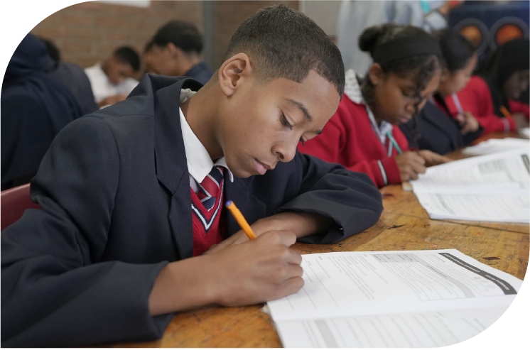 Learner writing in a Huddle classroom